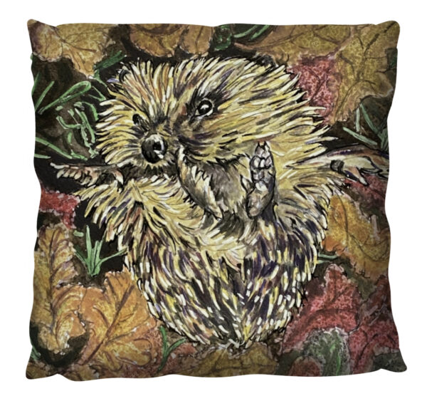 Hedgehog in the autumn leaves on a cushion
